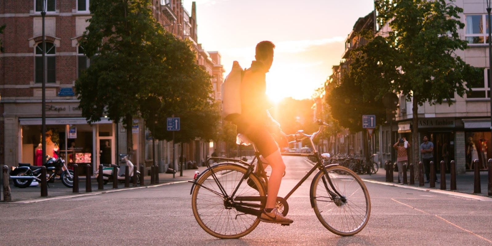 the benefits of cycling are numerous boy on a bike on a road