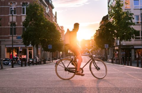 the benefits of cycling are numerous boy on a bike on a road